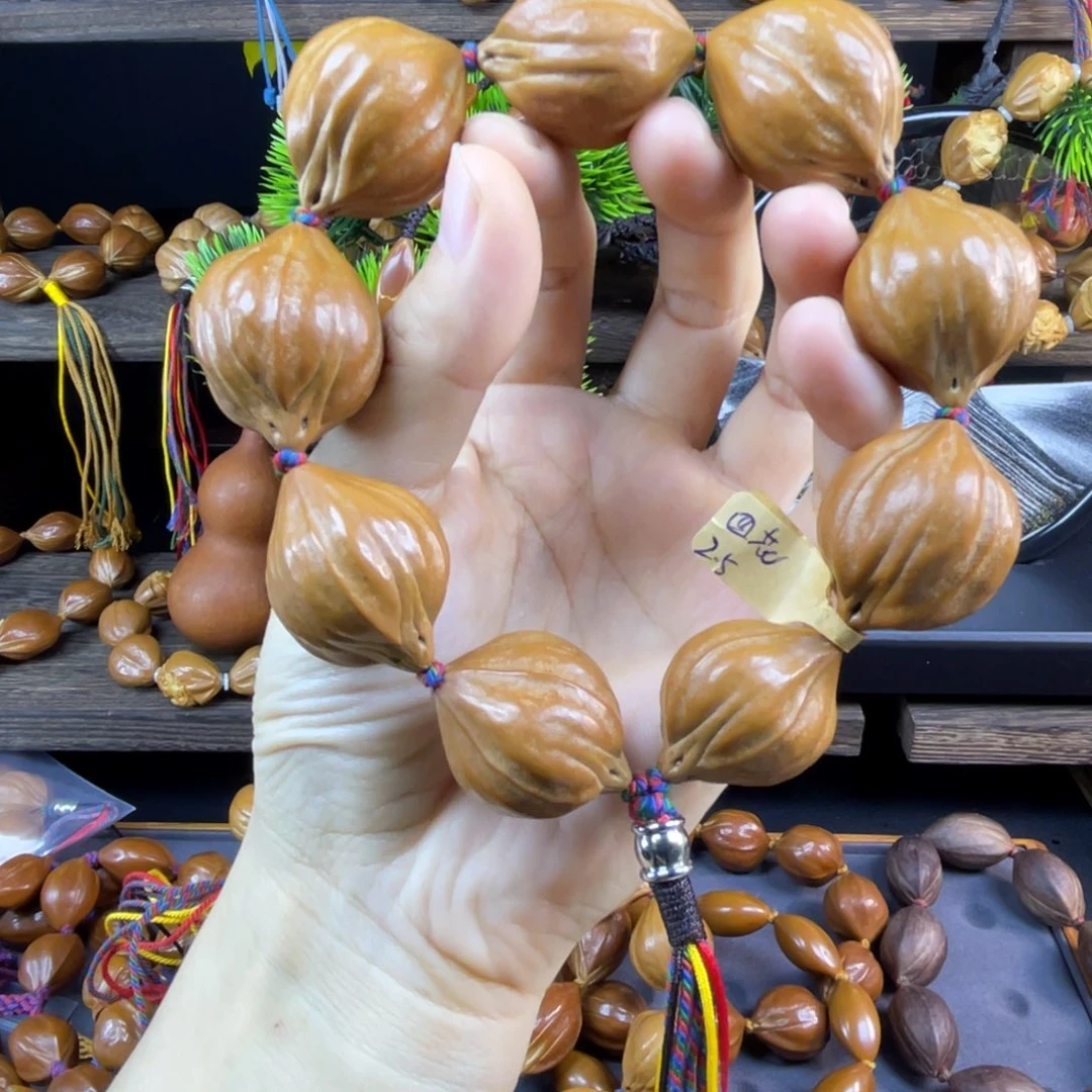 皓***橄榄核吊坠026.2.5四花
