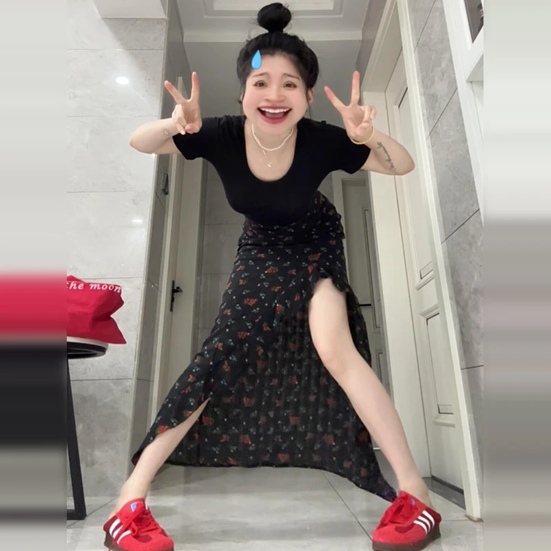 黑色碎花不规则开叉半身裙子女夏季2026新款小众设计高腰包臀长裙