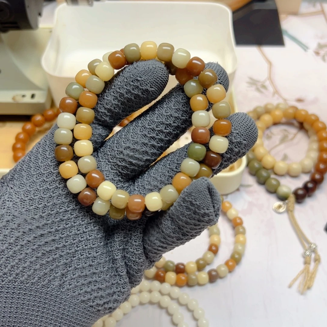 菩提根/象牙果手串戒****能9×8绒刨双圈56颗