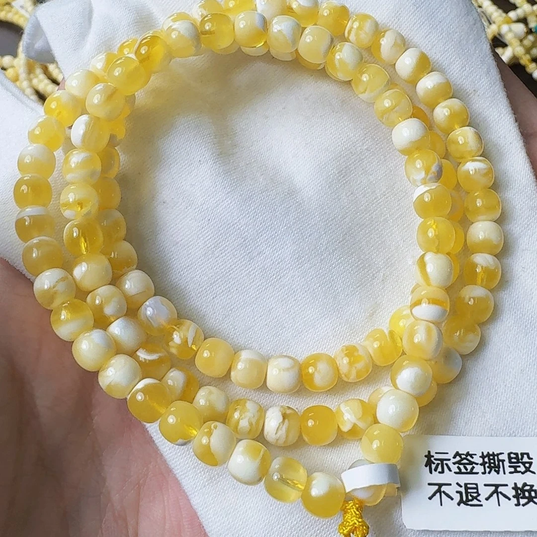 裸石琥珀未镶嵌6.5mm金瓷白溶洞108