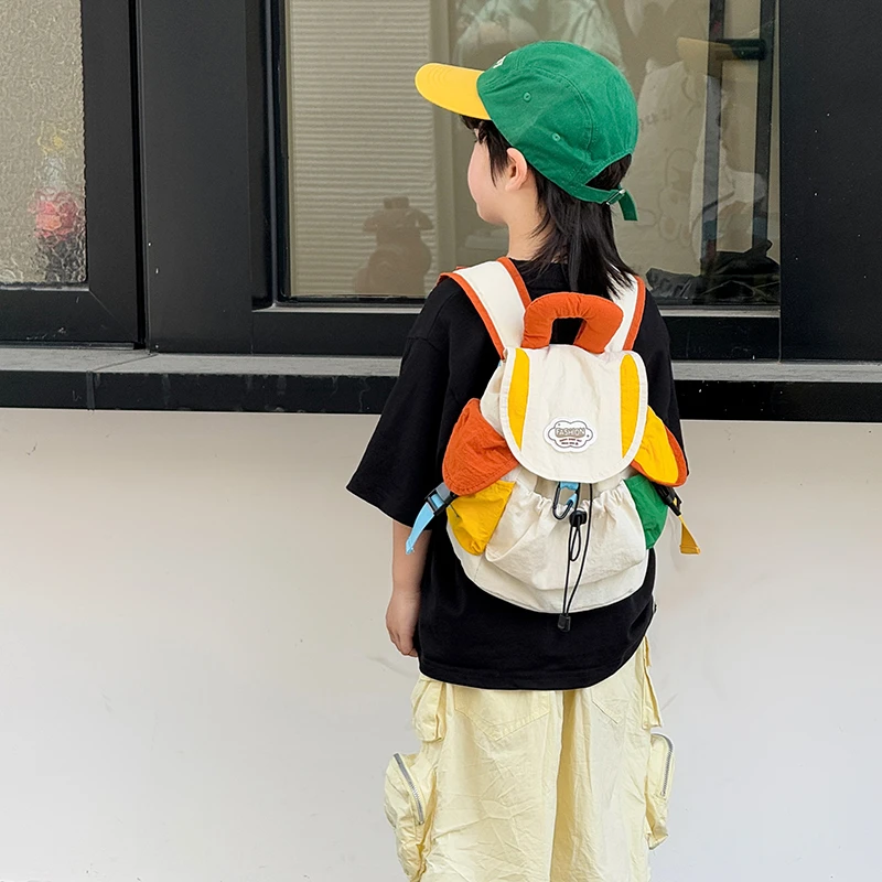 幼儿园小学生儿童书包2025新款时尚撞色男女孩外出游轻便研学背包