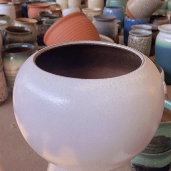 紫砂花盆高23口21。