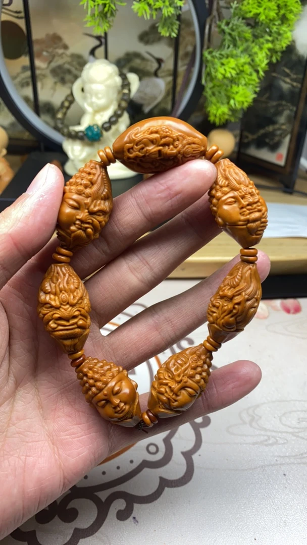 橄榄核雕工艺手串佛魔一念强