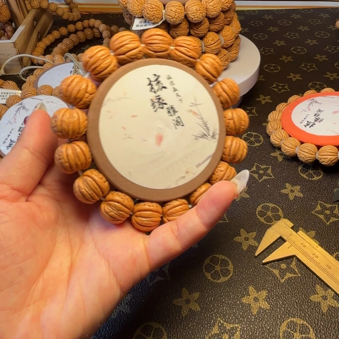 展***5手串桃核6号链接。