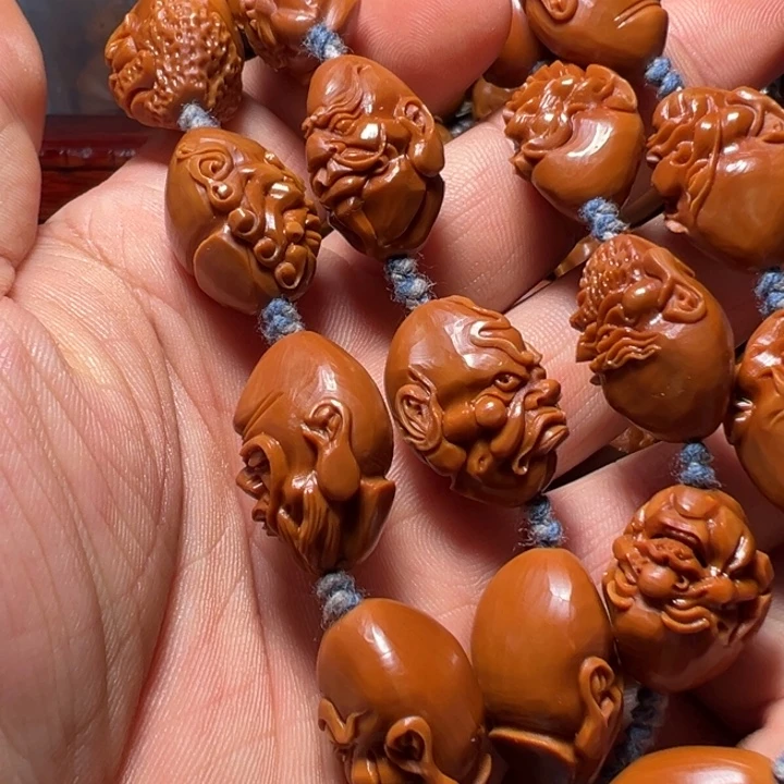 w***v橄榄核手串/手链怪脸手持