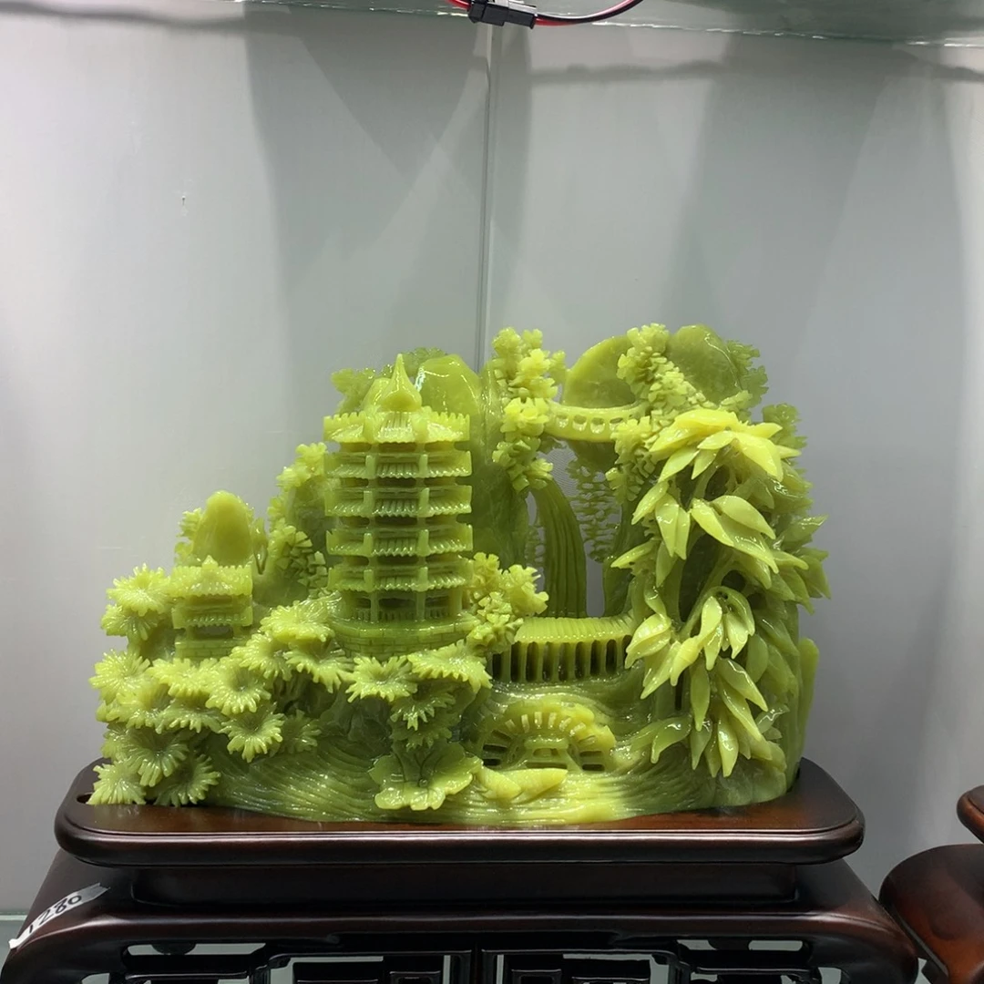 玉寓意财运亨通。山水摆件
