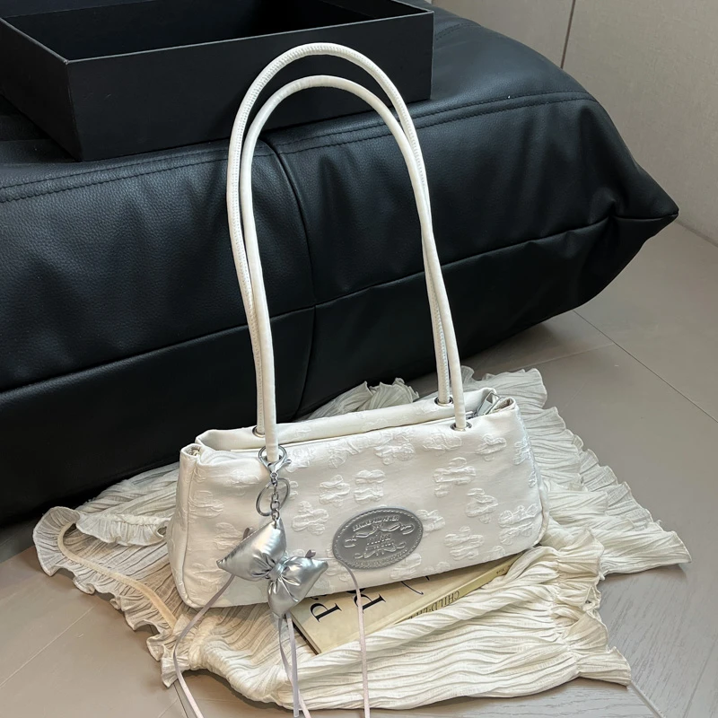 高级感上班通勤腋下包夏天大容量包女2025新款白色帆布提花法棍包