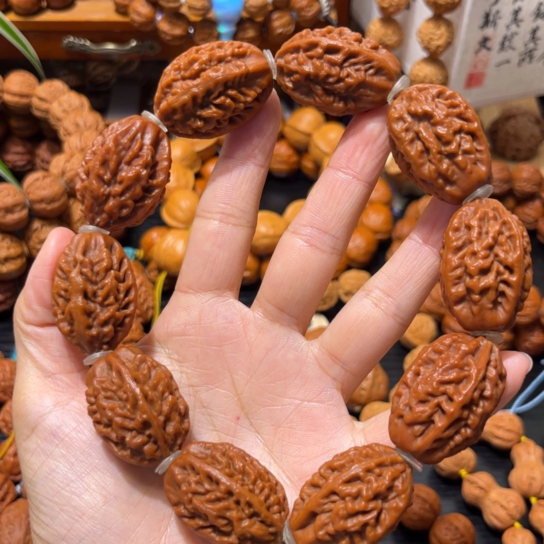 吊坠桃核淡**心鱼骨纹手持