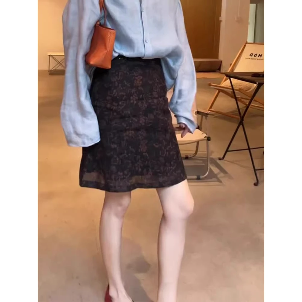 黑棕色山茶花设计感气质短裙女2025年夏季新款时尚百搭碎花半身裙