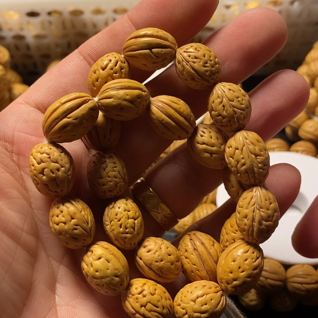 勾***器吊坠桃核桃核手持