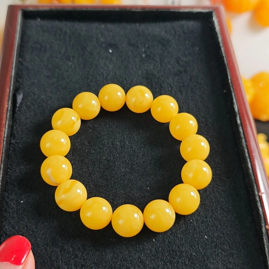 手串蜜蜡未镶嵌同料手串14m。