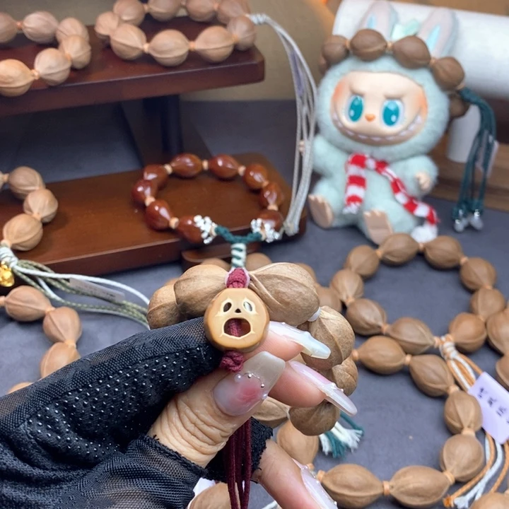 弥***生橄榄核手串/手链囧脸