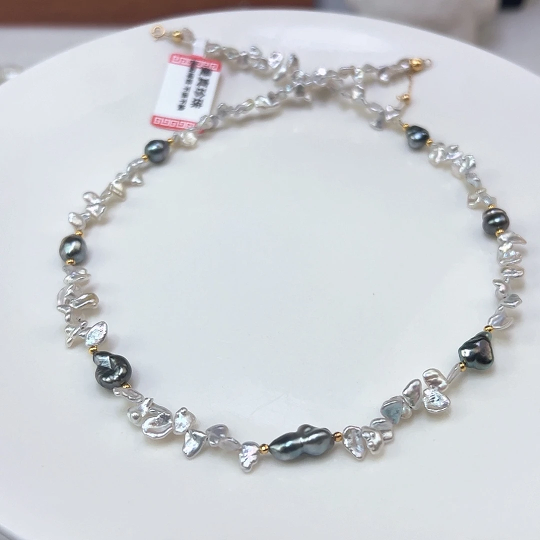 袁***基颈饰18K金镶嵌海水珍珠