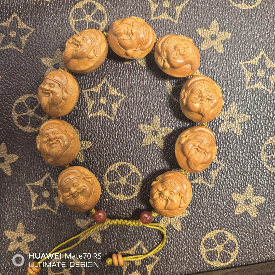 橄榄核雕刻财神头