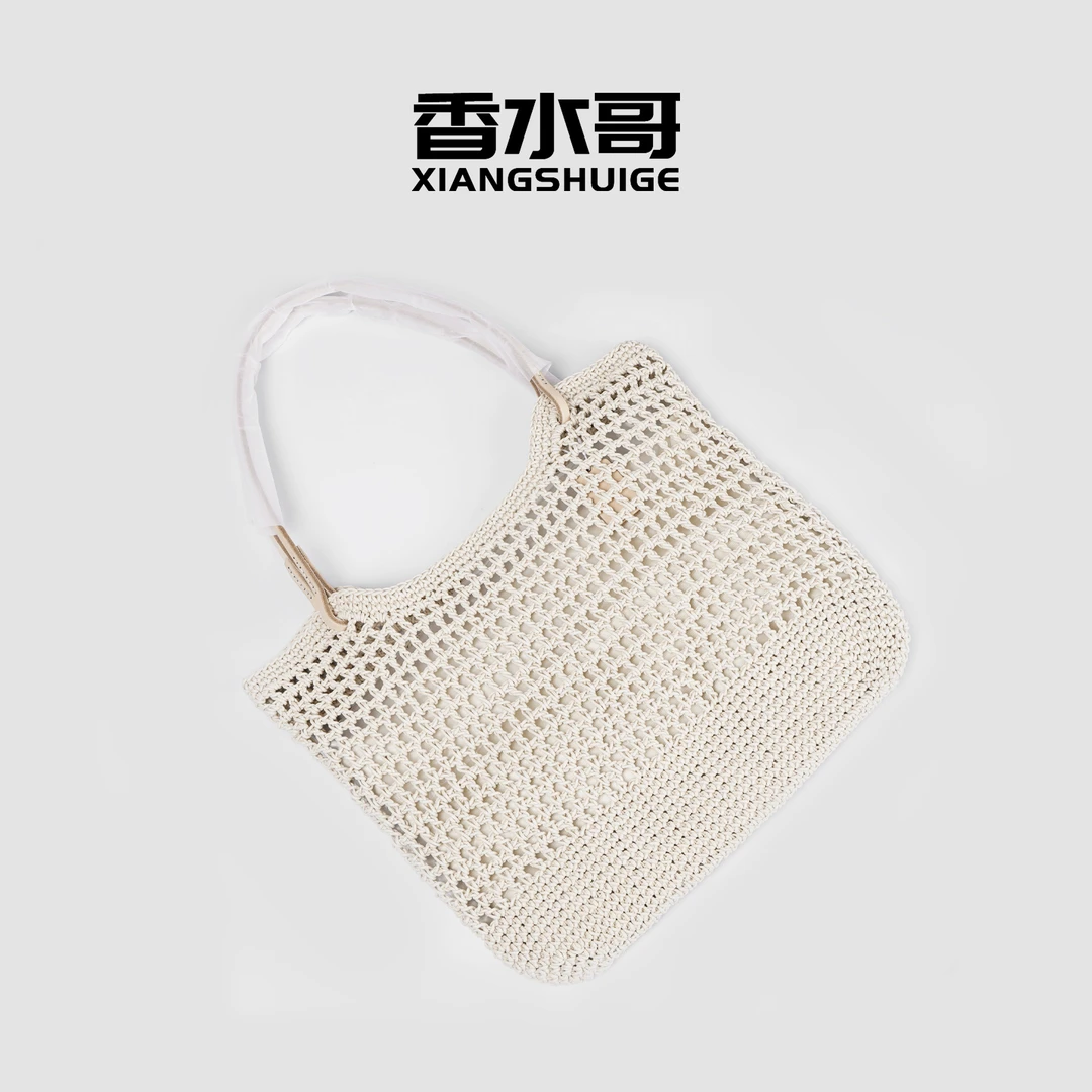 米黄色手提包2025新品时尚休闲包包编织包沙滩镂空米色购物袋