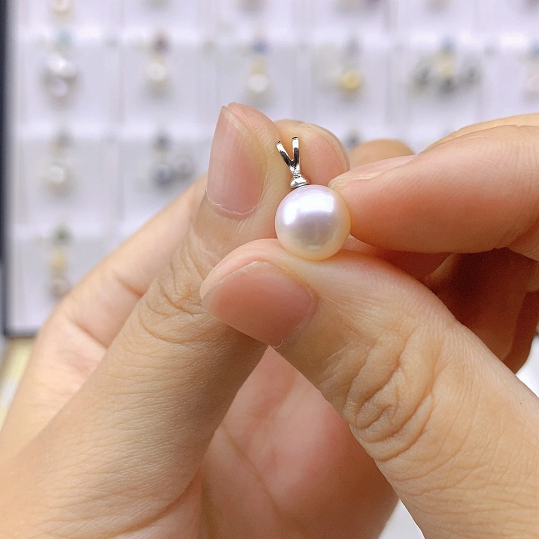 陽****淡水珍珠银S925镶嵌吊坠(赠链)