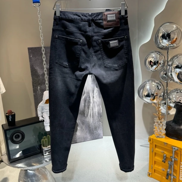 秋季高端货金属标重磅水洗黑做旧复古修身小脚裤男弹力微锥牛仔裤