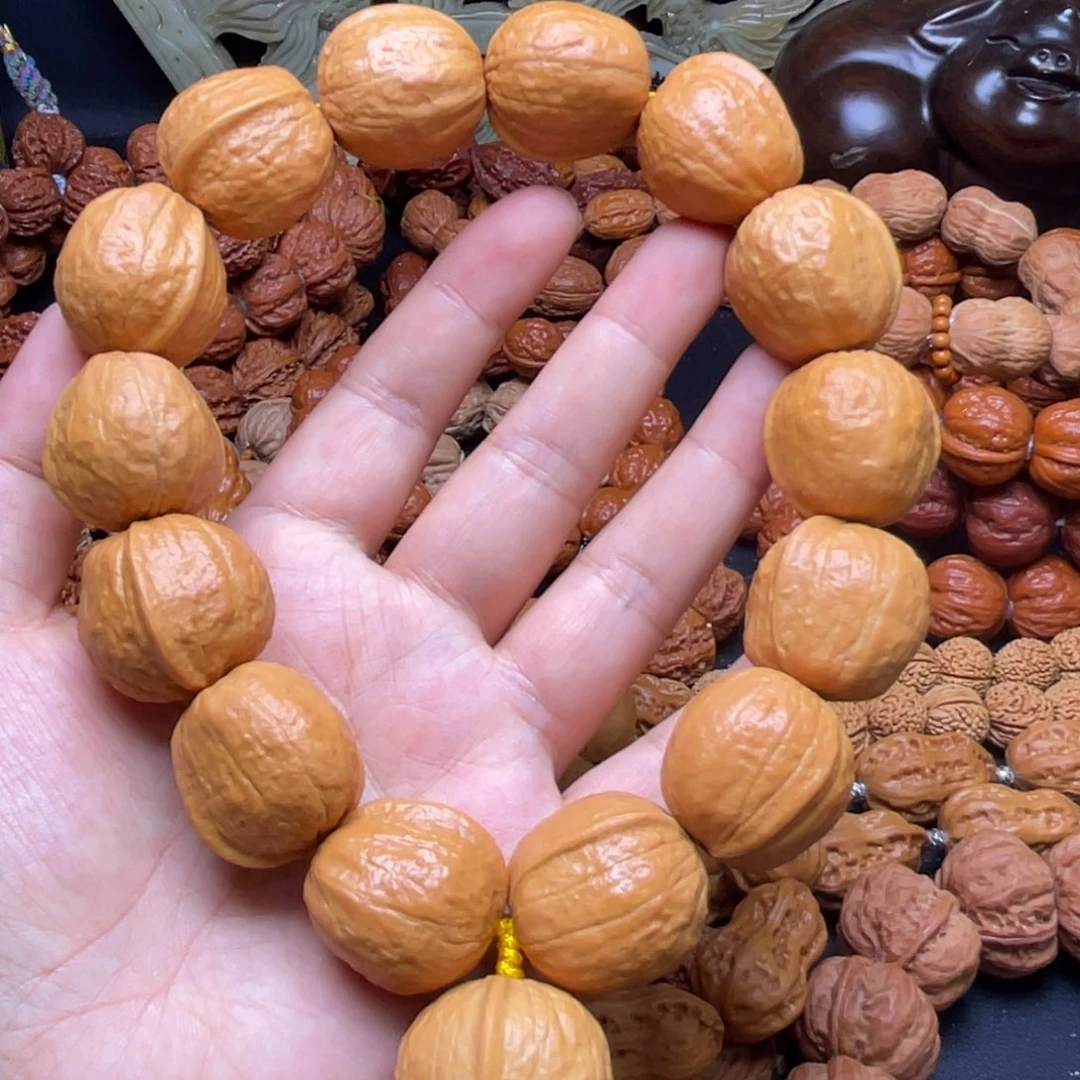 ঞ****文玩核桃吊坠木鱼
