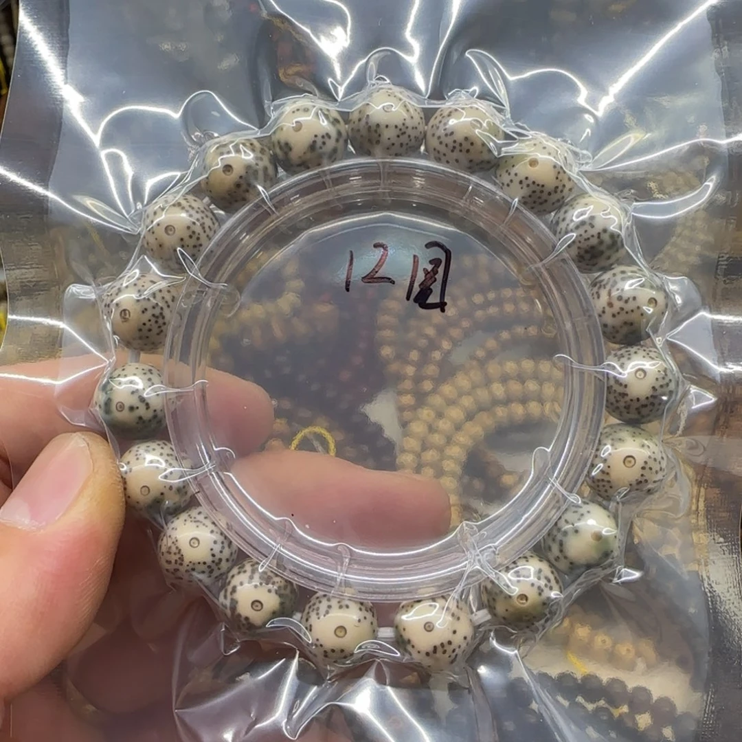 胡***.星月菩提吊坠12圆石玉料青花瓷手串