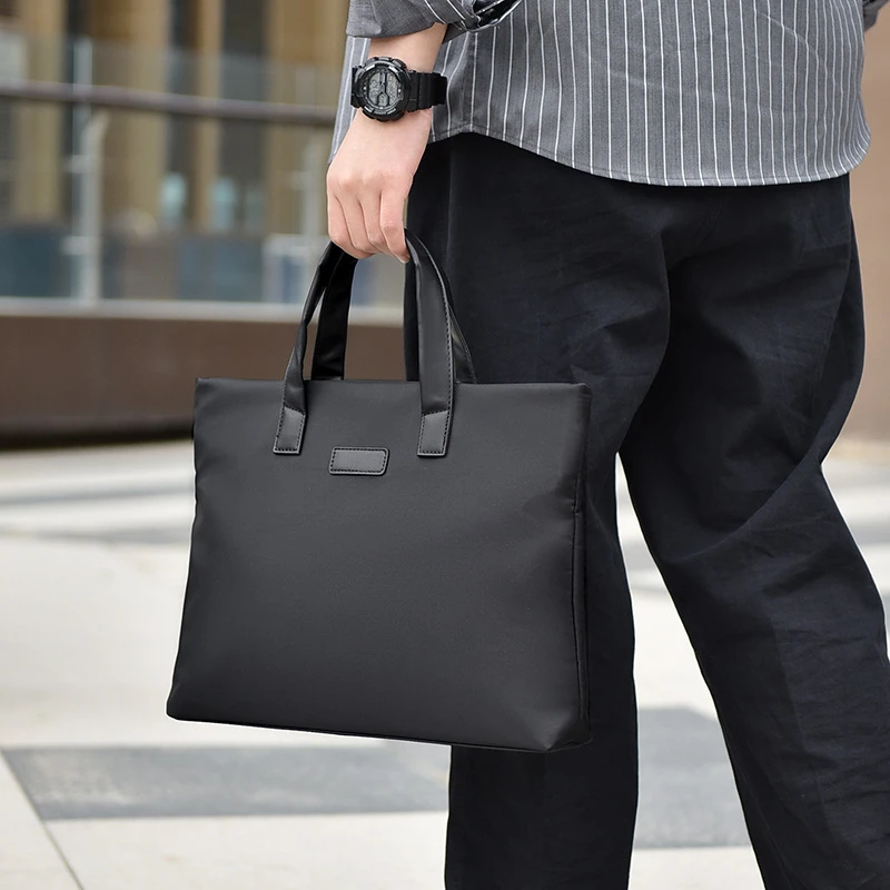 男士手提文件包大容量商务男包纯色简约电脑包公文包会议文件袋
