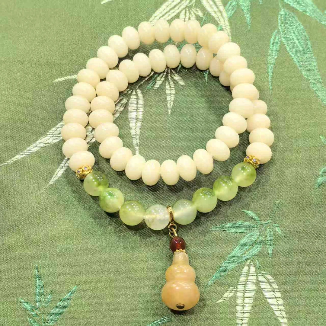 JG0003-米白色菩提0.6*0.8-51颗+葫芦挂饰