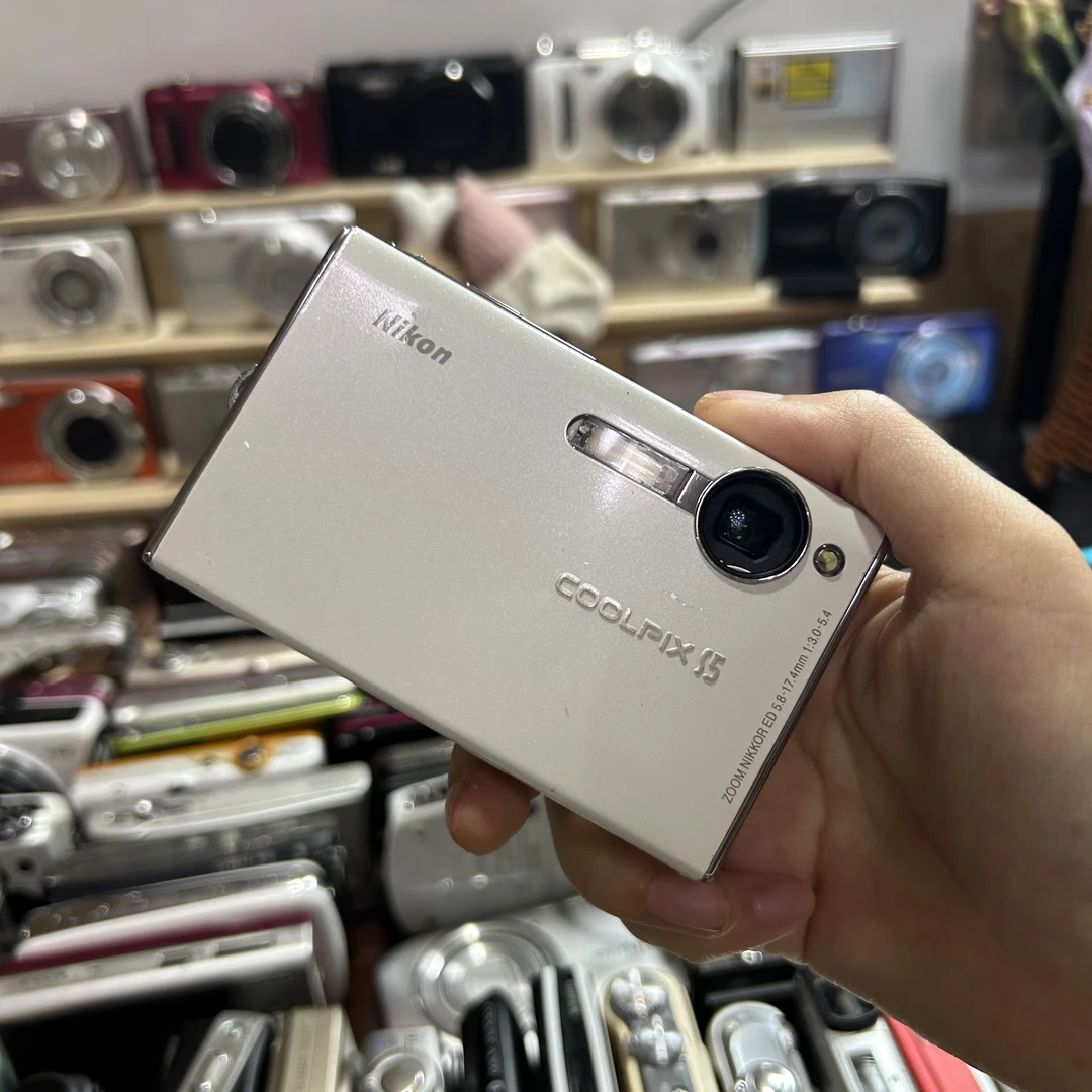 9新 Nikon/尼康 尼康s5奶白色镜头门帘用手碰一下
