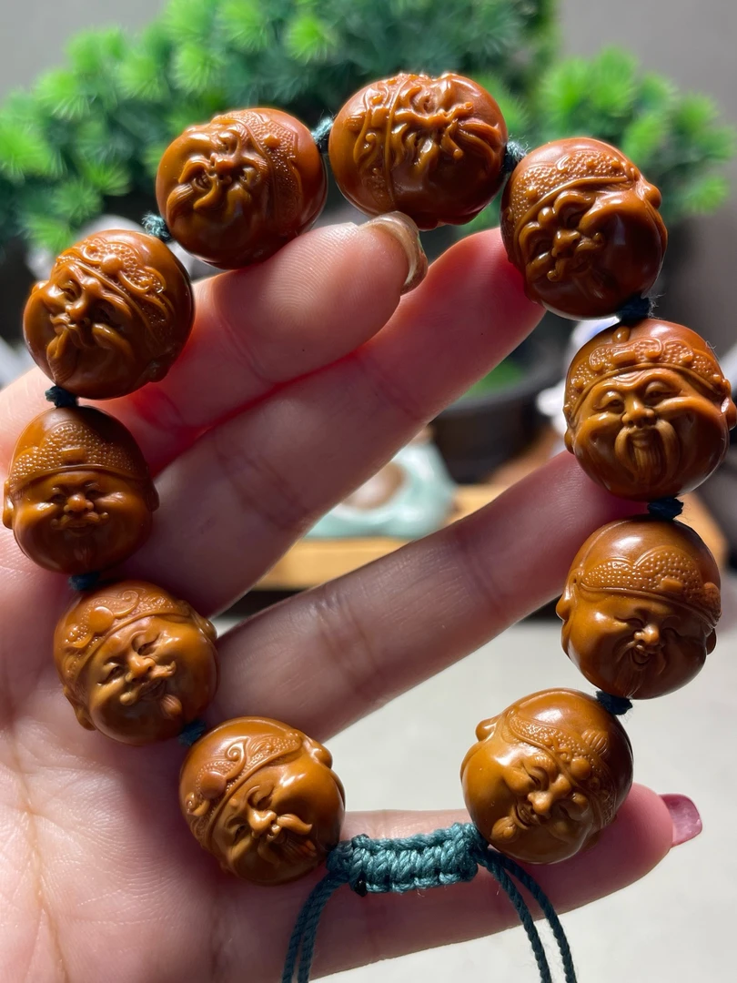 1.9财神头地主头十分有财财神百态精品橄榄核雕文玩手串