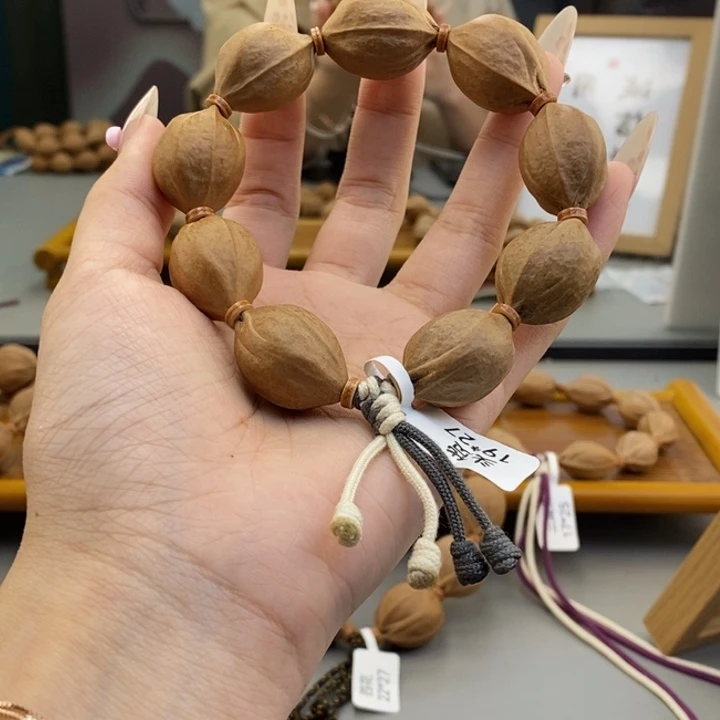 吊坠橄榄核M****」梅林铁