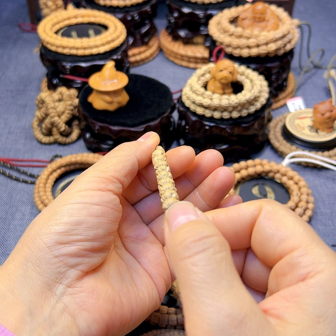 倌***人手串柏香籽/百香籽