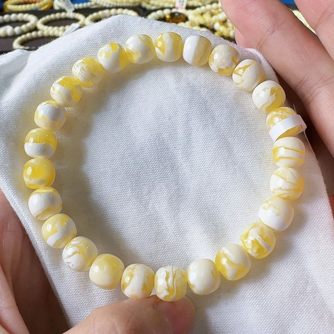 一***汁裸石琥珀未镶嵌8.5mm金瓷白虎皮