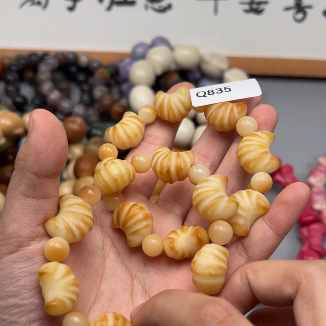 吊坠菩提根/象牙果Q835牛角包16-18通货一串随机