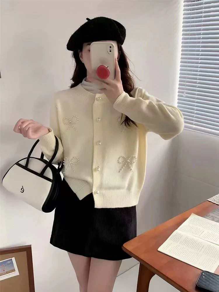 8025韩系温柔风甜美蝴蝶结钉珠毛衣外套女秋冬时尚洋气宽松显瘦