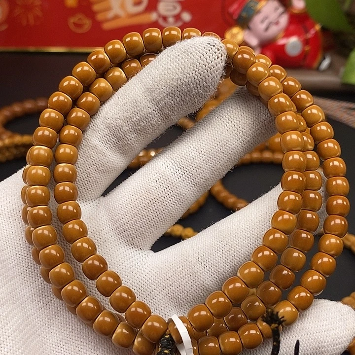 橄榄核手串6.7老挝核尖正三花108微白加长款