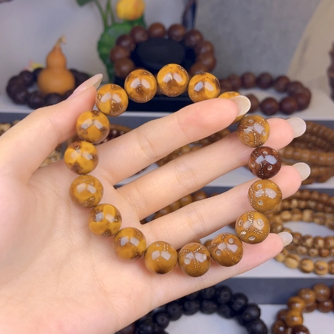 漫***牛手串紫金鼠花皮差价