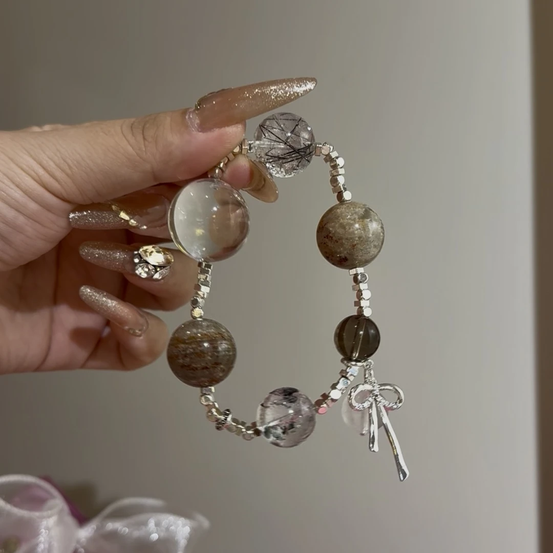 财富引力牛鼻孔➕茶晶➕闪灵钻➕千层幽灵➕黑发晶原创设计款手串