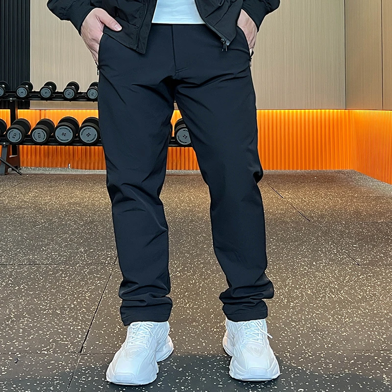 新款秋冬男士户外弹力加绒保暖直筒轻运动防泼长裤高端商务休闲裤
