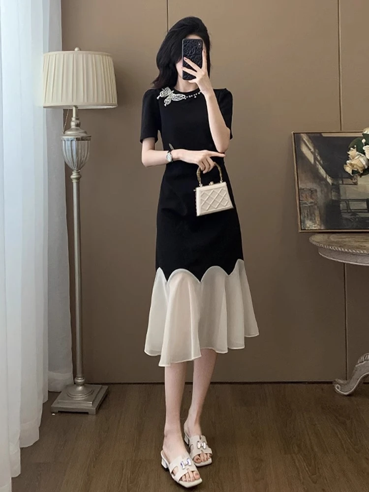 0682黑色短袖连衣裙女夏2025今年流行爆款气质拼接小众不撞款裙子