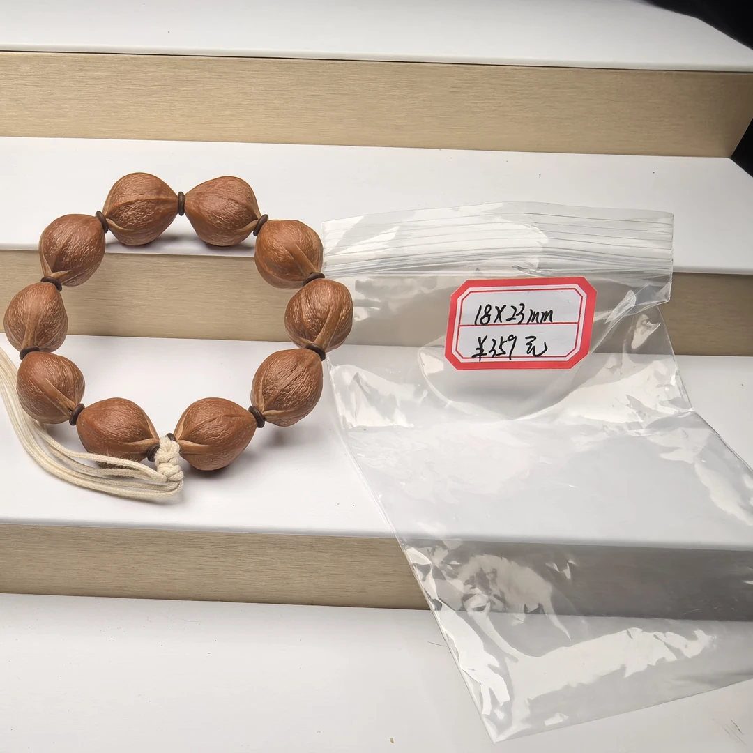 橄榄核手串，18×23尺寸，文玩素串，色泽红润通透。