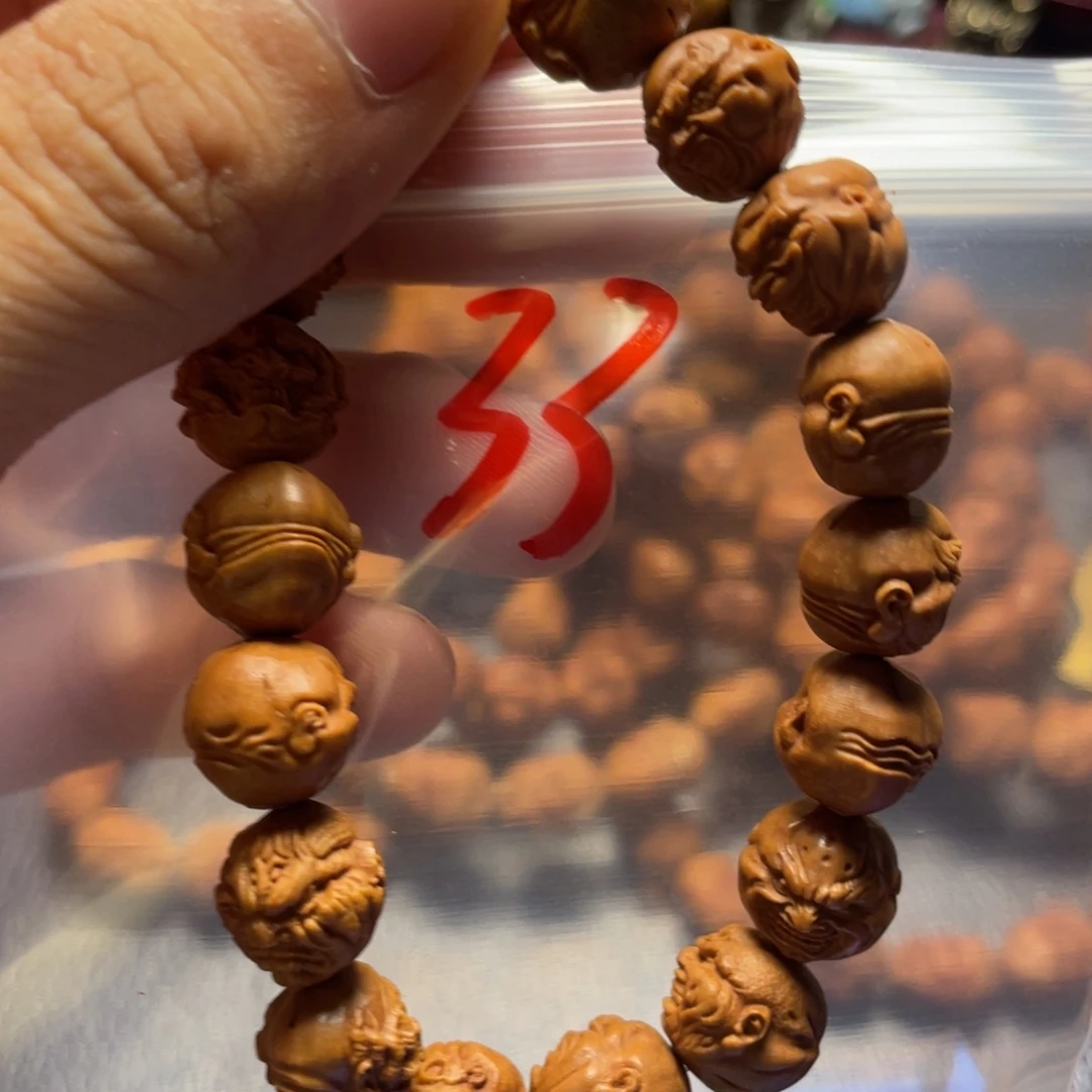 龙纹桃核雕刻瑕疵恶僧