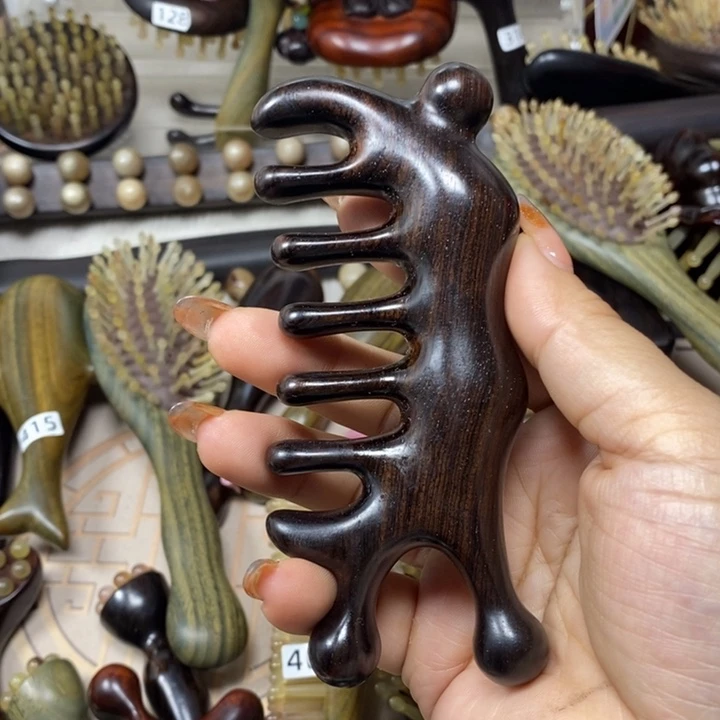 紫光檀蜗牛按摩梳微毛孔