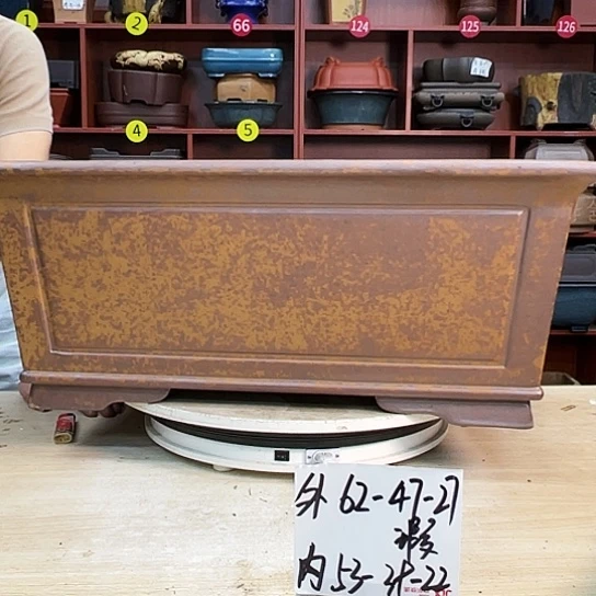 你***~紫砂花盆中放的有五百