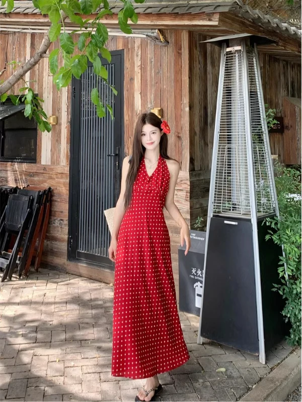 法式气质波点印花挂脖连衣裙女夏季收腰显瘦碎花海边度假露背长裙