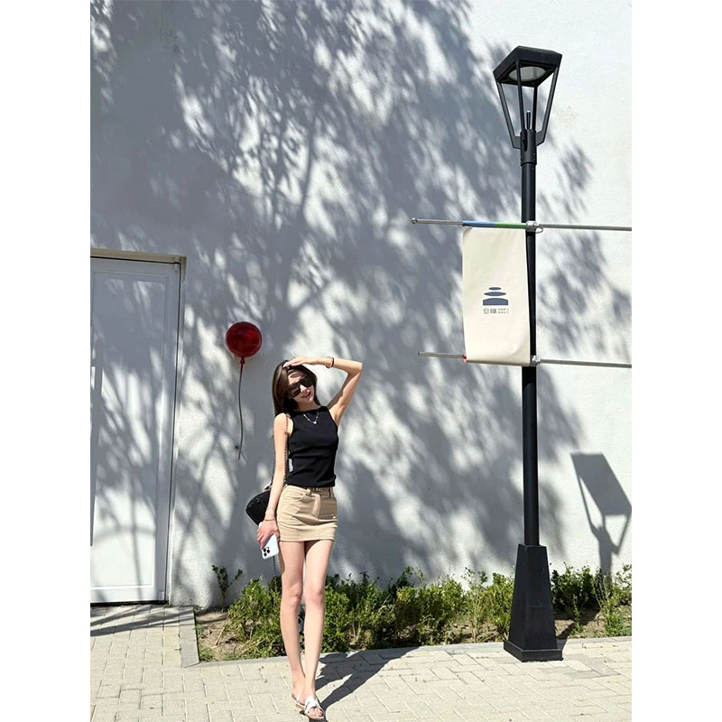 辣妹风修身黑色无袖上衣女夏季纯欲设计感工装包臀短裙子两件套装