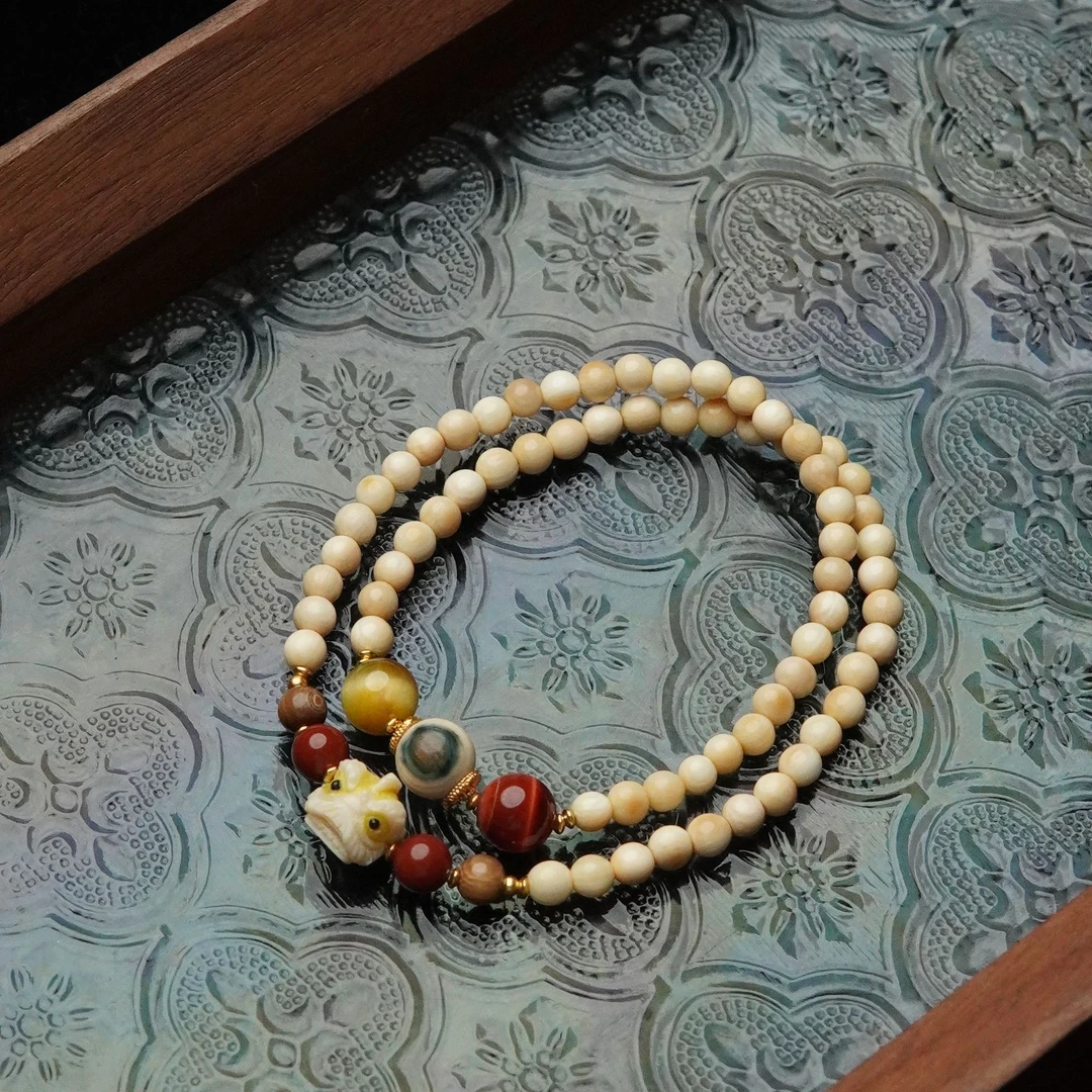 狮来运转 天然猛犸牙飘咖料4mm圆珠雕刻醒狮双圈手串