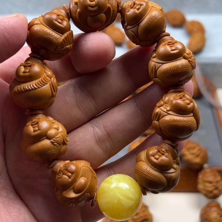 沐***橄榄核手串橄榄核雕工艺制作