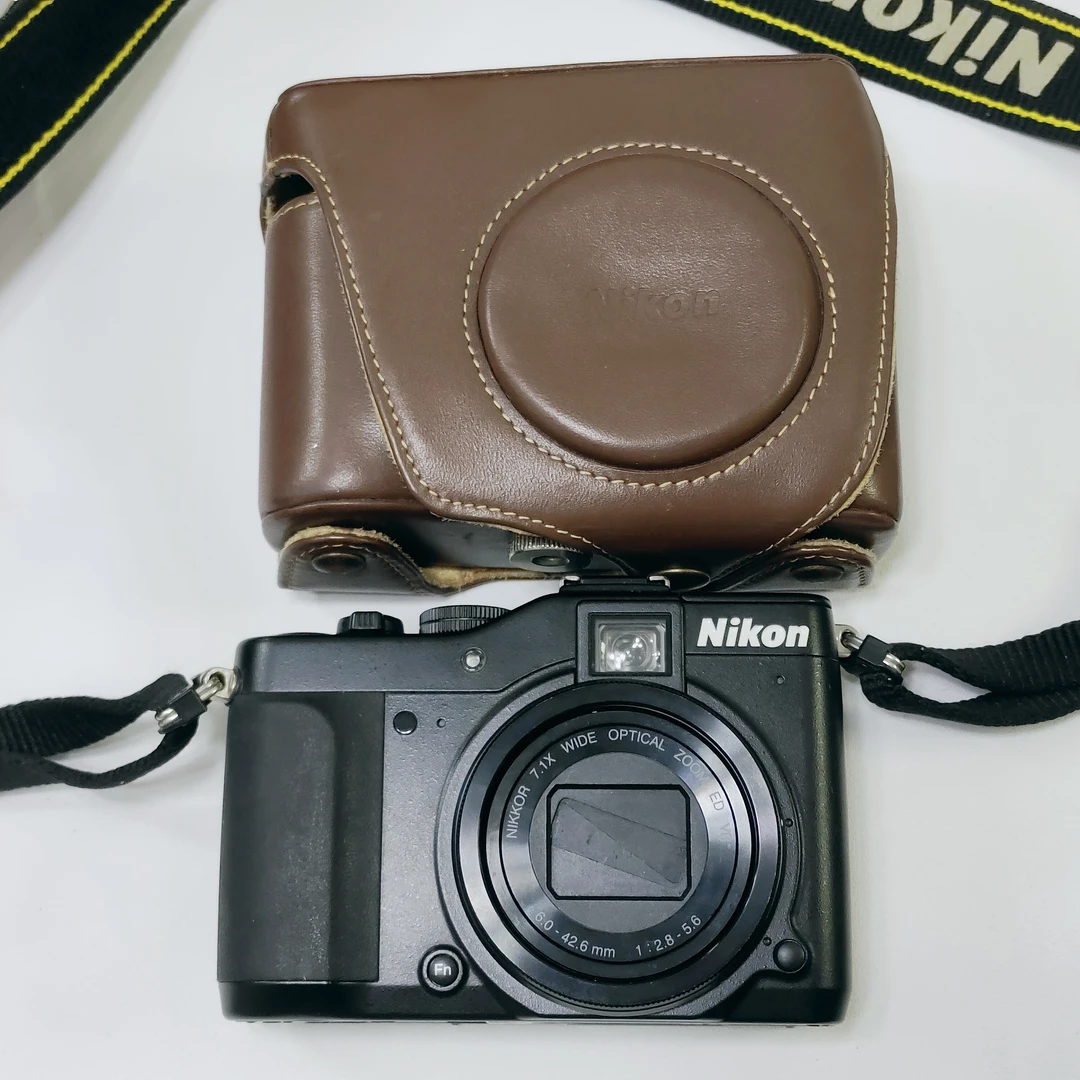 9新 Nikon/尼康 p7000中文带皮包/门帘松动/1010万像素7.1倍光学