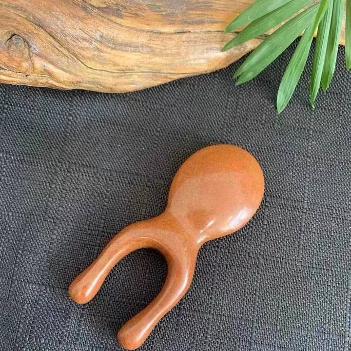 泗水砭石大正玄黄泗水砭石手动按摩砭娃