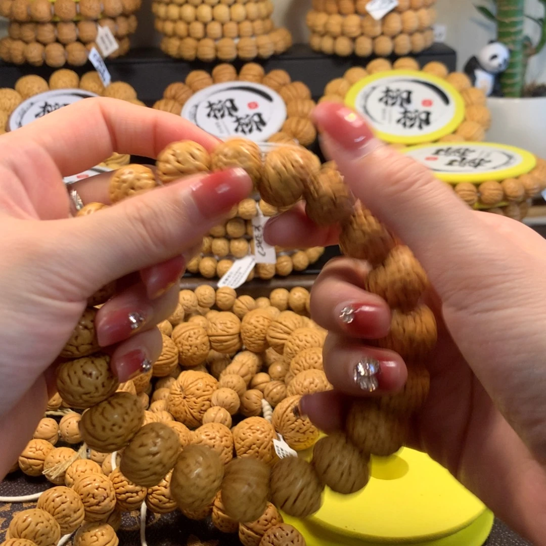北***八精品桃核纽扣手串