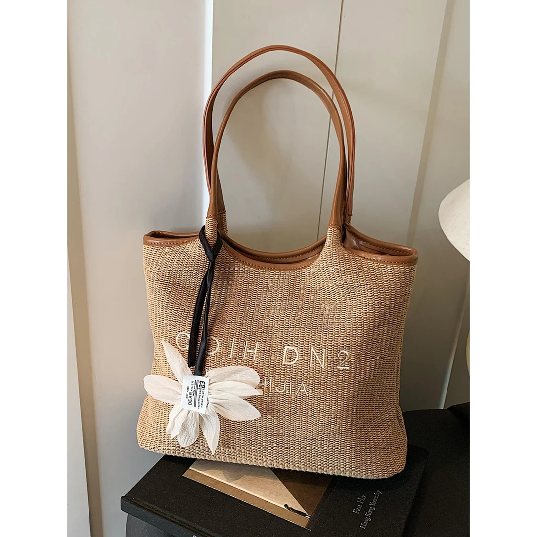 海边度假风编织沙滩包女2025新款休闲通勤单肩包大容量草编托特包