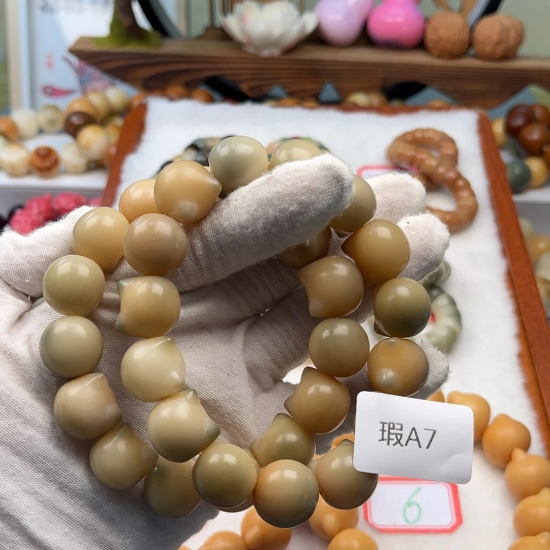 菩提根/象牙果手串瑕A7猫头15mm一串随机